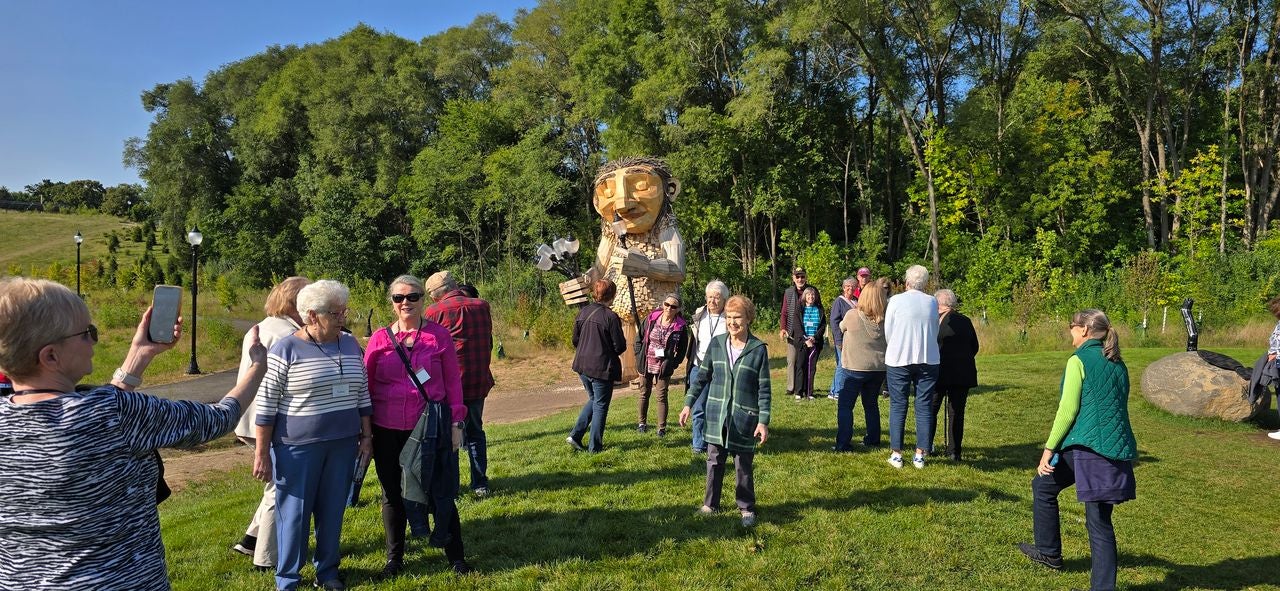 Thomas Dambo Troll Driving Tourists to Wisconsin