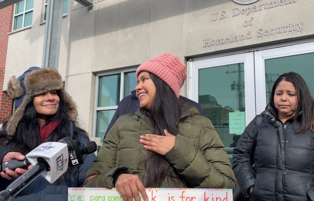 Yessenia Ruano gestures toward her heart after learning she’ll have more time to work on application for legal status before being deported. Scores of protestors turned out to support Ruano on Friday, Feb. 14 before he appointment at the Milwaukee field office of U.S. Immigration and Customs Enforcement. Courtesy of Voces de la Frontera