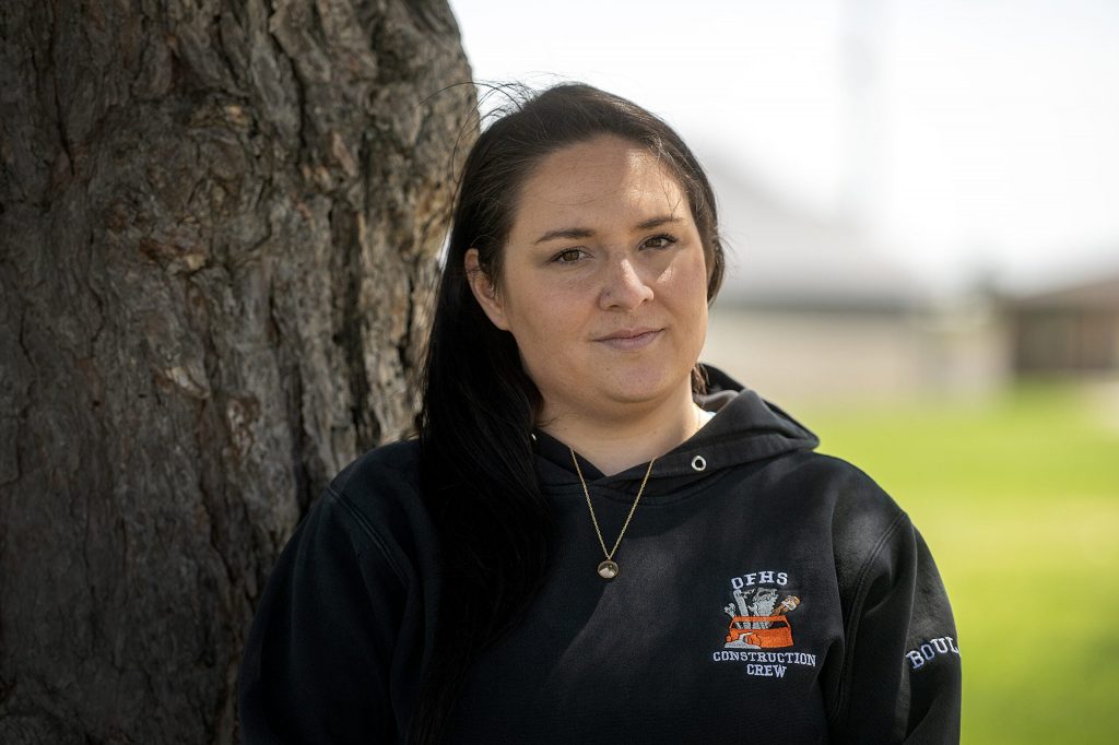 Amanda Watzka wears her Oconto Falls High School Construction Crew hoodie Tuesday, May 12, 2026, in Oconto Falls, Wis. Angela Major/WPR