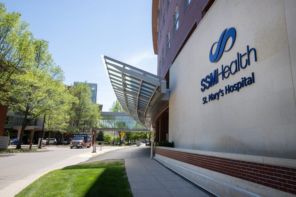 An ambulance passes by SSM Health St. Mary’s Hospital on Thursday, May 14, 2026, in Madison, Wis. Angela Major/WPR