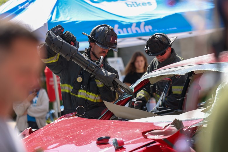 Milwaukee firefighters demonstrate a car extraction during the Vision Zero Summit. (Photo by Jonathan Aguilar / Milwaukee Neighborhood News Service / CatchLight Local)