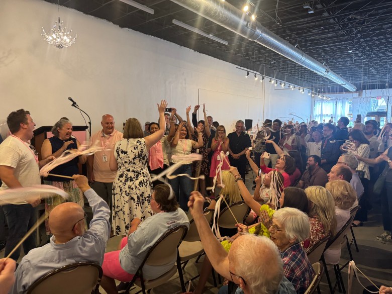 Attendees of Pink Umbrella Theater Co.’s ribbon-cutting ceremony celebrated on June 7 in Milwaukee. (Photo by Jake Dale/Milwaukee Neighborhood News Service)