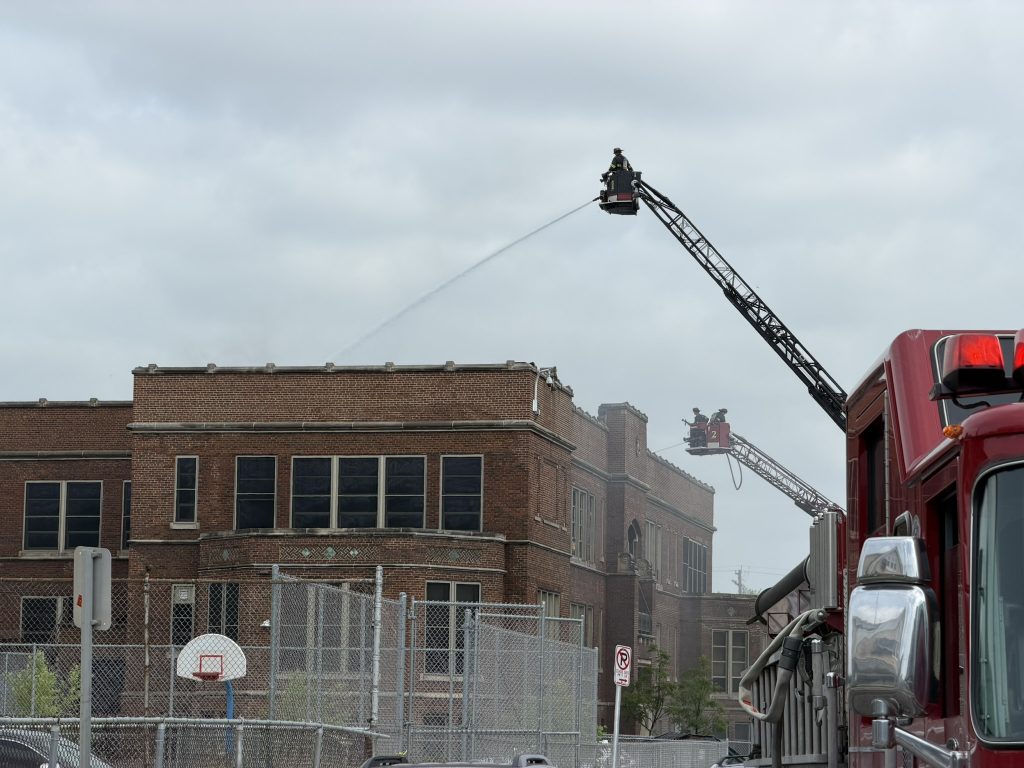 Firefighters attempt to extinguish a blaze at Lincoln Avenue Elementary School. Photo by Jeramey Jannene.