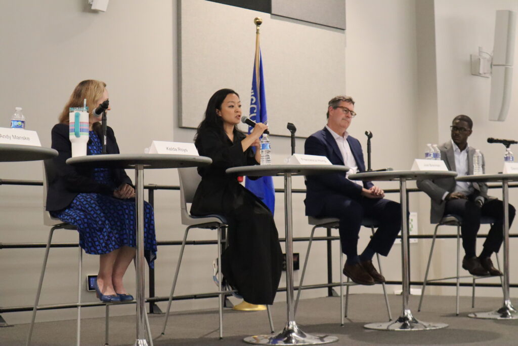 WISDOM hosts a forum with seven gubernatorial candidates. Francesca Hong speaks to the crowd as Kelda Roys, Joel Brennan and David Crowley look on. (Isiah Holmes/Wisconsin Examiner)