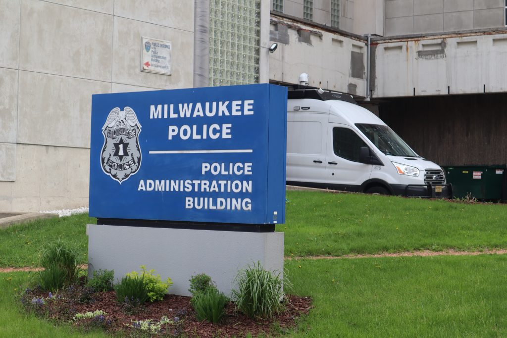 The Milwaukee Police Administration Building downtown. A surveillance van, or “critical response vehicle” is in the background. (Photo by Isiah Holmes/Wisconsin Examiner)