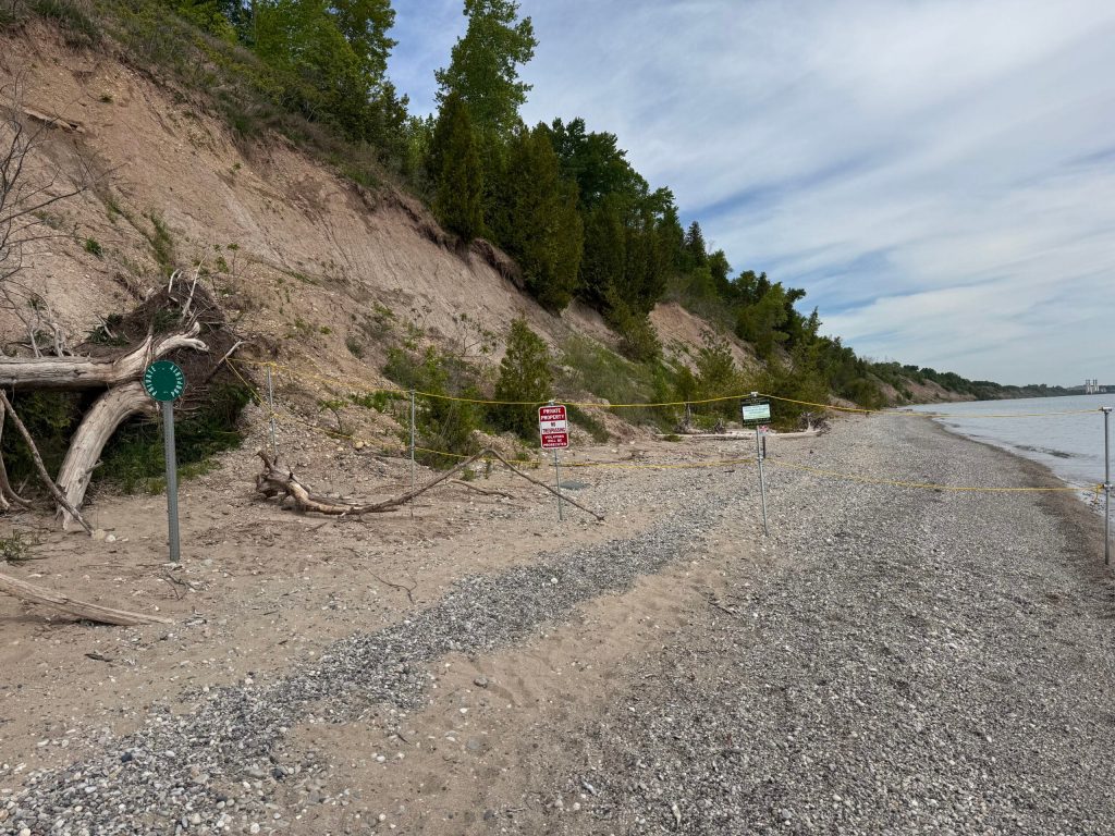 The private property signs are a short walk to the left of the trail that leads to the beach. Evan Casey/WPR