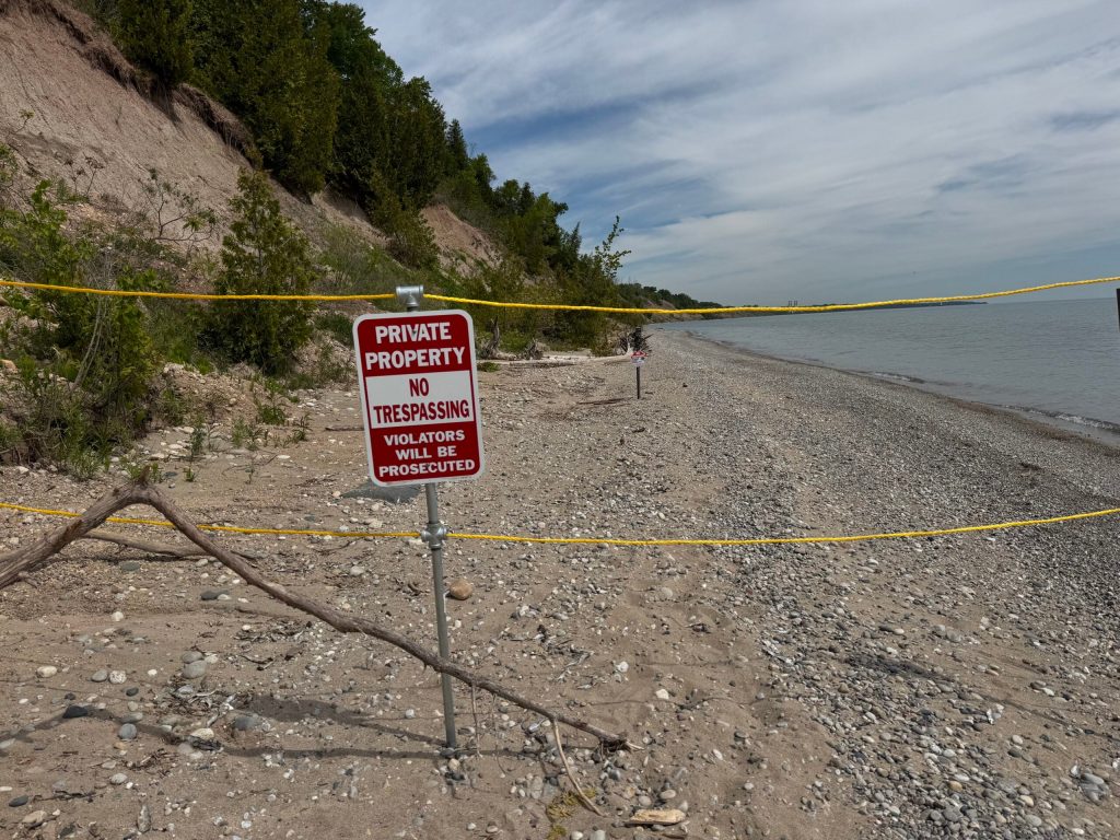 A private property sign and rope is seen here next to Lion’s Den Gorge Nature Preserve in Ozaukee County on June 3, 2026. Evan Casey/WPR