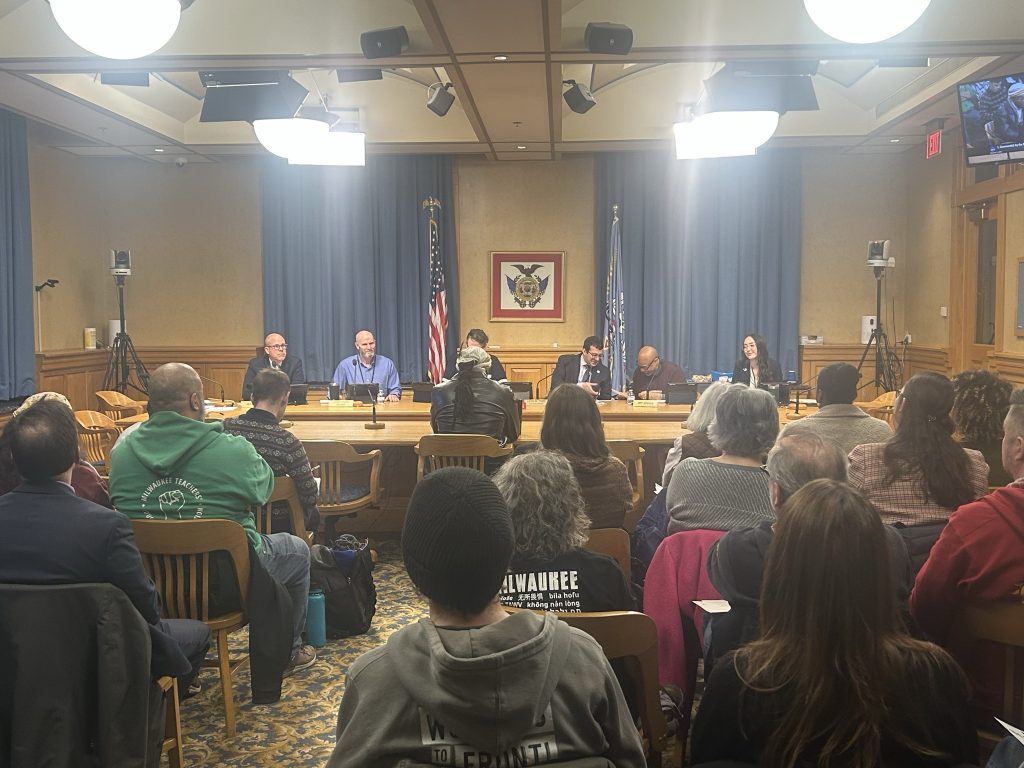 People fill a Milwaukee Fire and Police Commission meeting protesting Flock and facial recognition technology. (Photo by Isiah Holmes/Wisconsin Examiner)