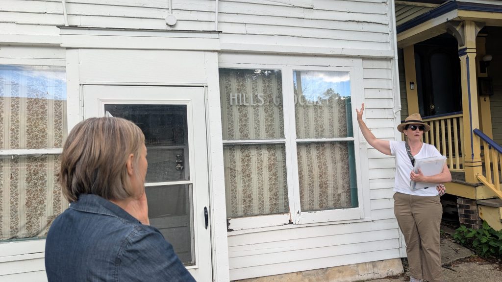 A sign for the store still hangs in the building’s window. (Photo by Baylor Spears/Wisconsin Examine)