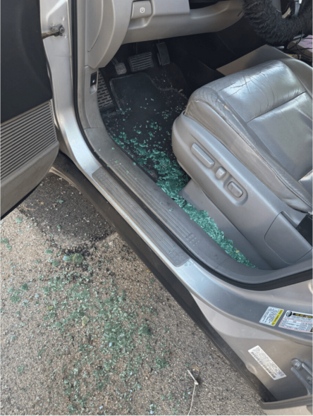 The remnants of Estenderly Marte Polanco’s driver-side window remain on the pavement after U.S. Immigration and Customs Enforcement agents arrested the mother from the Dominican Republic in Milwaukee on June 27, 2026. (Courtesy of the family of Estenderly Marte Polanco)