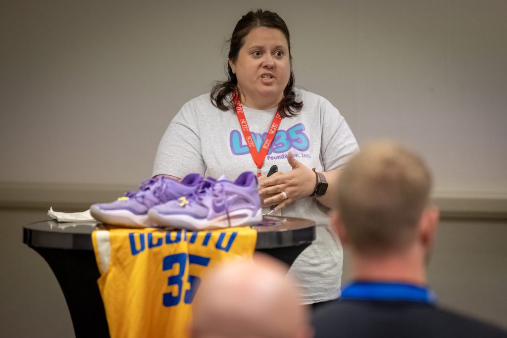 Jamie Weigelt speaks on sextortion at the 2026 School Resource Officer Training Conference, an annual event hosted by the National Criminal Justice Training Center of Fox Valley Technical College, on June 9, 2026, in Appleton, Wis. Her son, Landen, died by suicide after being sextorted online in 2023. (Mike Roemer for Wisconsin Watch)