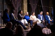 Rep. Francesca Hong, third from left, speaks to the audience during the year’s first Democratic gubernatorial candidate forum, Jan. 21, 2026, at The Cooperage in Milwaukee. The candidates are, from left, Lt. Gov. Sara Rodriguez, Milwaukee County Executive David Crowley, Hong, Sen. Kelda Roys, former Wisconsin Economic Development Commission CEO Missy Hughes, former Department of Administration Secretary Joel Brennan and former Lt. Gov. Mandela Barnes. (Joe Timmerman / Wisconsin Watch)