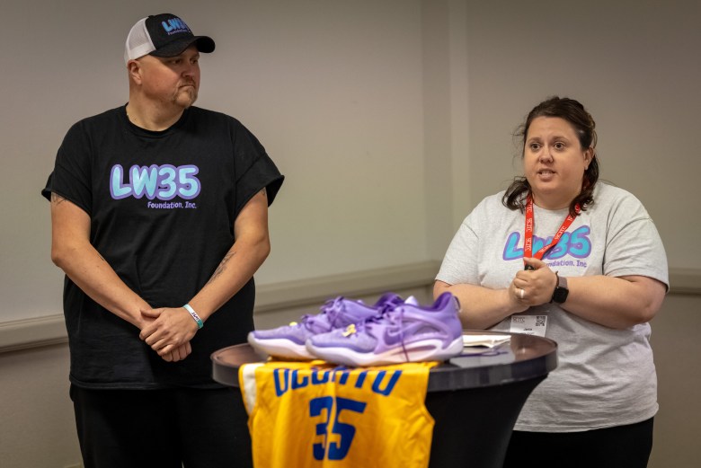 From left, Jared and Jamie Weigelt speak about sextortion at a training conference for school resource officers. They are among several Wisconsin parents who educate students, teachers and law enforcement officers about sextortion after losing their children to suicide. (Mike Roemer for Wisconsin Watch)