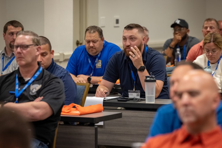 Attendees listen to Jamie and Jared Weigelt during a training conference for school resource officers. When local law enforcement receives sextortion CyberTips from the state’s Internet Crimes Against Children Task Force, school resource officers are often called immediately to help locate the child or teenager. (Mike Roemer for Wisconsin Watch)