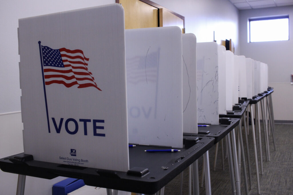 Voting booths set up at Madison, Wisconsin's Hawthorne Library on Election Day 2022. The Wisconsin Department of Justice, representing the Wisconsin Elections Commission, said in a filing with the 7th Circuit Federal Court of Appeals Thursday, June 18, that the federal government has no right to the state's unredacted voter lists. (Photo by Henry Redman/Wisconsin Examiner)