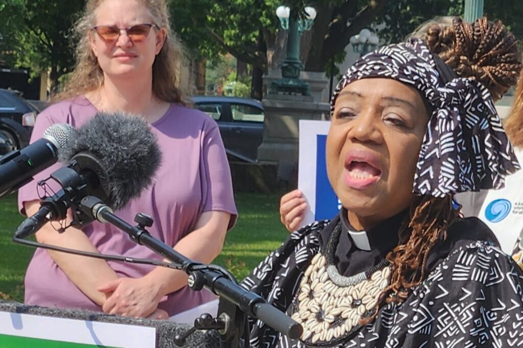 Rev. Teresa Thomas-Boyd, a faith partnership consultant for the Walnut Way Conservation Corp. in Milwaukee, speaks at a news conference in Madison Tuesday calling on Wisconsin's next governor to commit to a clean energy future. Behind her to the left is Laura Lane, Wisconsin outreach director for Faith In Place. (Photo by Erik Gunn/Wisconsin Examiner)