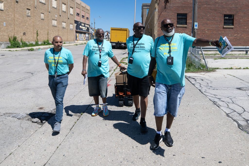 A group from Milwaukee County Adult Protective Services carry a wagon full of Naloxone as they do community outreach Friday, June 12, 2026, in Milwaukee, Wis. Angela Major/WPR