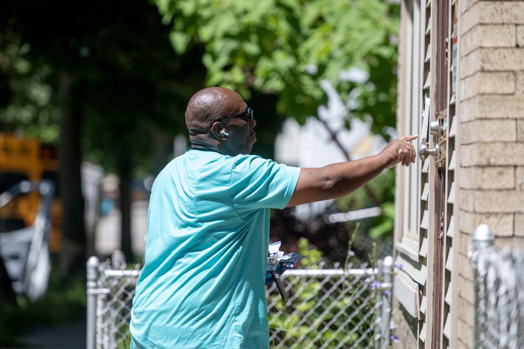 A group from Milwaukee County Adult Protective Services knocked on doors as part of a harm reduction effort Friday, June 12, 2026, in Milwaukee, Wis. Angela Major/WPR