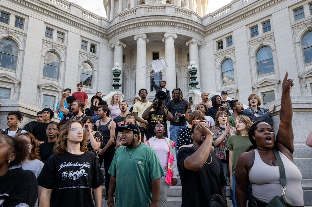 Protesters disrupt a Concerts on the Square event Wednesday, July 22, 2026, in Madison, Wis, after a Madison man was shot and killed by a police officer earlier that day. Angela Major/WPR