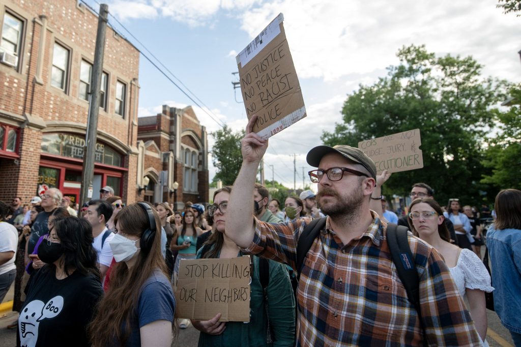 Protesters gather at the scene where a Madison man was shot and killed by a police officer Wednesday, July 22, 2026, in Madison, Wis. Angela Major/WPR