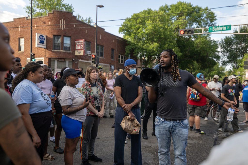 Protesters gather at the scene where a Madison man was shot and killed by a police officer Wednesday, July 22, 2026, in Madison, Wis. Angela Major/WPR