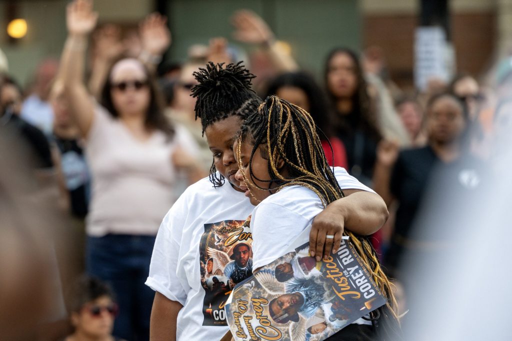 Corey Ruiz’s daughter, right, is embraced as she attends a vigil in memory of her father Thursday, July 23, 2026, in Madison, Wis. Ruiz was shot and killed by Madison police Wednesday afternoon. Angela Major/WPR