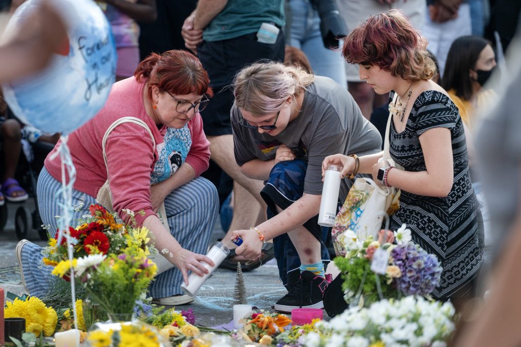 Vigil attendees light candles and pay their respects to Corey Ruiz, who was shot and killed by Madison police, on Thursday, July 23, 2026, in Madison, Wis. Angela Major/WPR
