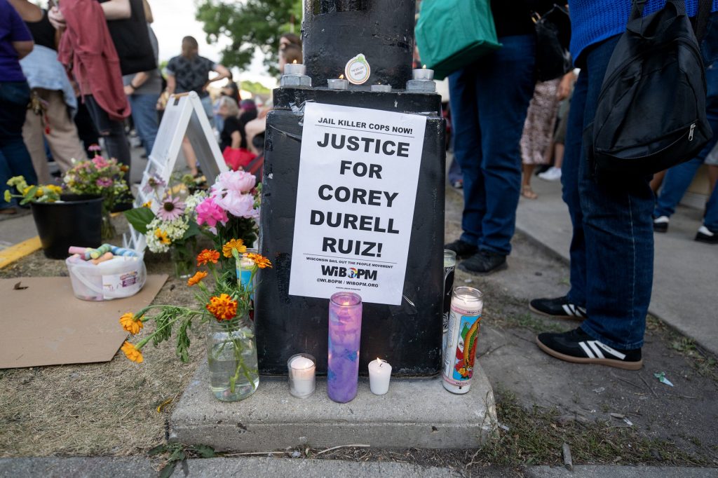Candles and flowers are placed in memory of Corey Ruiz on Thursday, July 23, 2026, in Madison, Wis. Angela Major/WPR