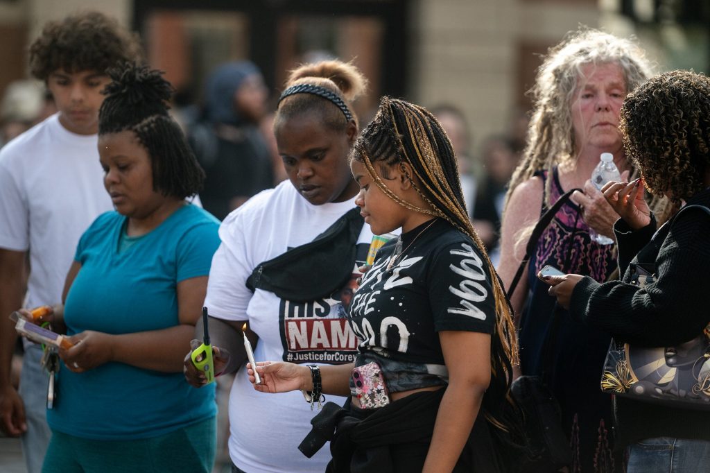 Corey Ruiz’s daughter holds a candle at a vigil for her father Thursday, July 23, 2026, in Madison, Wis. Angela Major/WPR