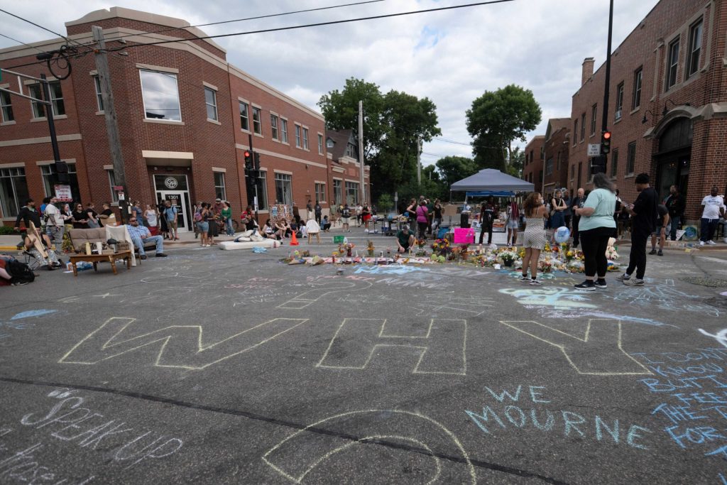 Chalk spells out the word “Why?” at a memorial for Corey Ruiz, 38, on July 23, 2026 in Madison, Wis. Ruiz was shot and killed by police on July 22, 2026. Angela Major/WPR