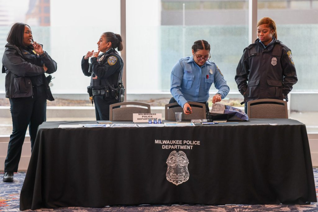 Milwaukee police officers participate in the All In, All Youth, All Summer resource and employment fair in April. A new plan that organizers hope will improve community/police relations was discussed Thursday. (Photo by Jonathan Aguilar / Milwaukee Neighborhood News Service / CatchLight Local)