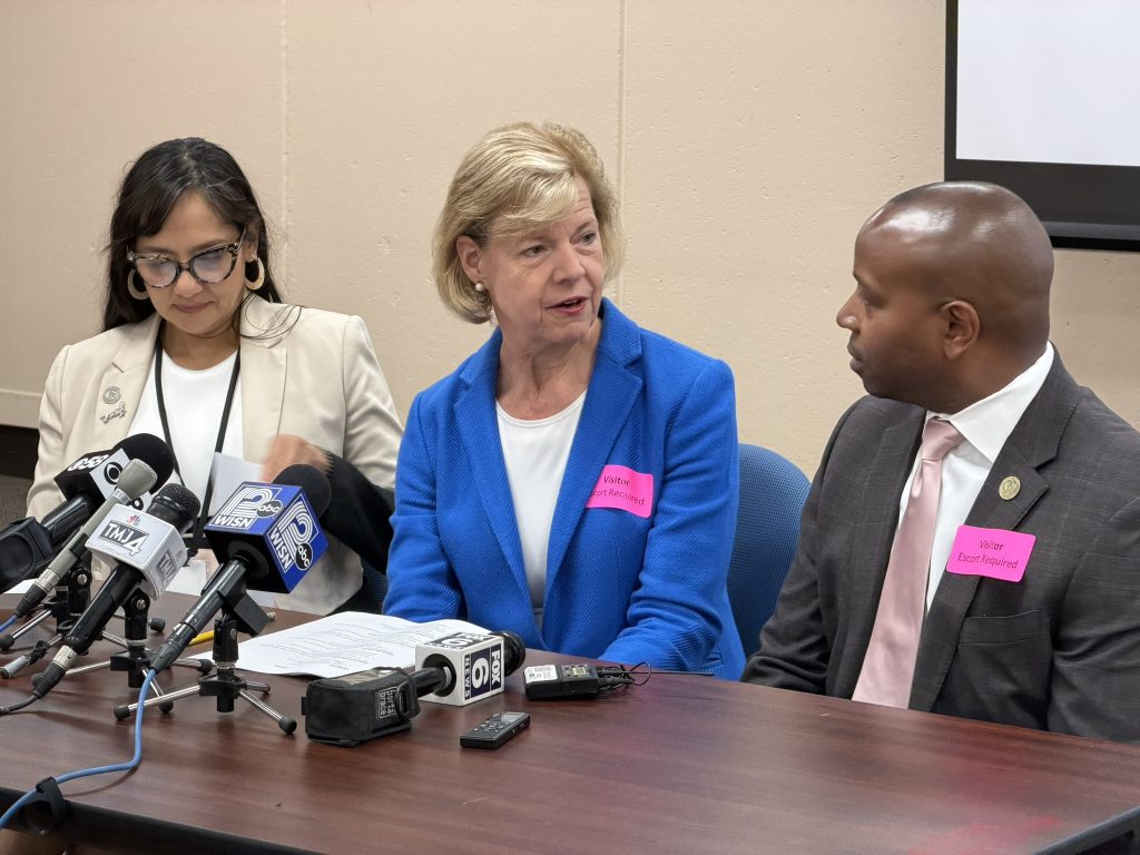 Sen. Tammy Baldwin (center) speaks with Mayor Cavalier Johnson (right) and Paulina Gutiérrez (left). Photo by Jeramey Jannene.