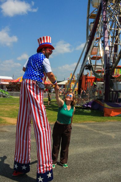 Berge greets a voter at the La Crosse County fair. (Photo by Henry Redman | Wisconsin Examiner)
