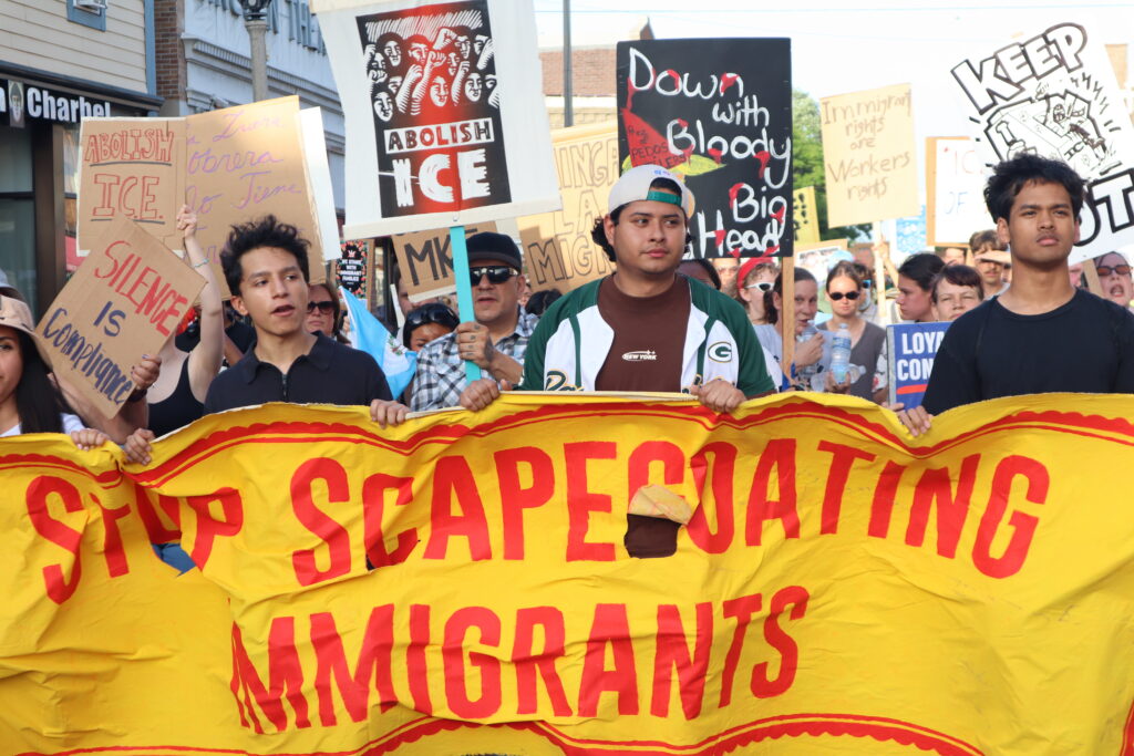 Galo Suárez, whose fiance Reyna Elizabeth Garcia was arrested by ICE over the weekend, marches with allies on Milwaukee's South Side. (Photo by Isiah Holmes/Wisconsin Examiner)