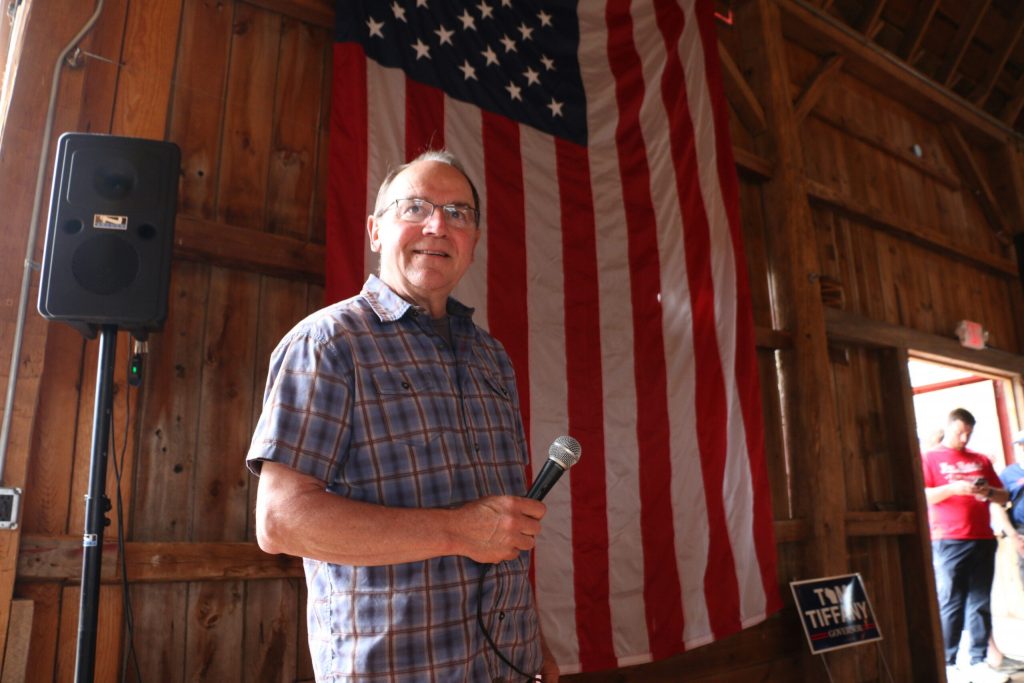 Republican Congressman Tom Tiffany enters the Elderberry Manor wedding barn in West Bend to a standing ovation by supporters attending his gubernatorial campaign’s “Freedom Fest” event in June. Rich Kremer/WPR