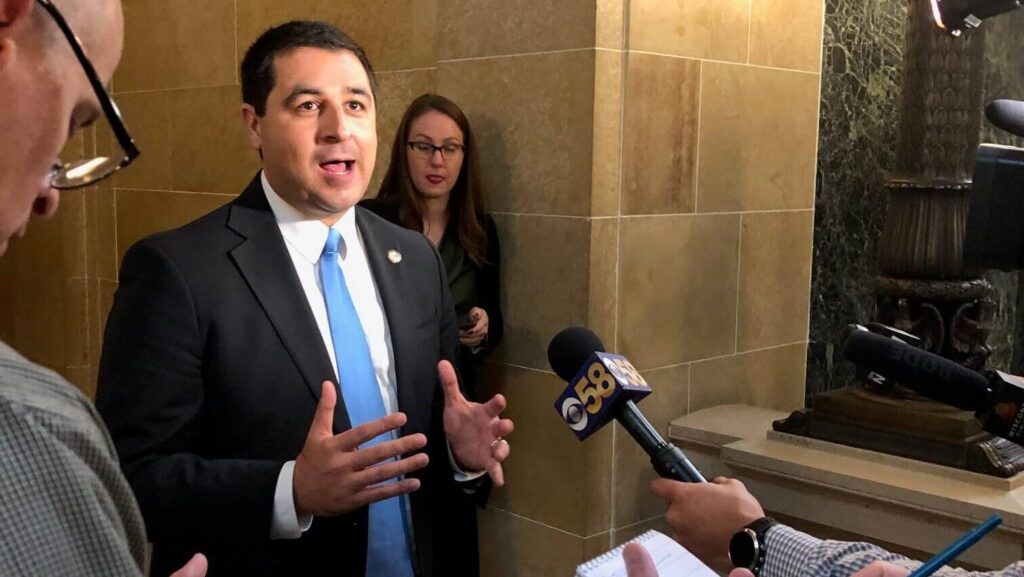 Attorney General Josh Kaul speaks with reporters outside the Wisconsin Supreme Court in February 2023. (Wisconsin Examiner photo)