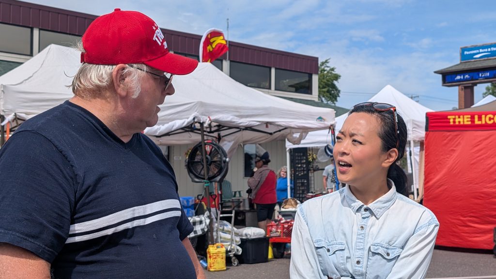 Robert Olson speaks to Hong in Hayward (Photo by Baylor Spears/Wisconsin Examiner)