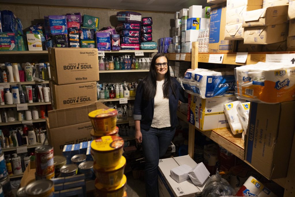 Mindy Lohff, executive director of Safe Haven, a domestic abuse shelter in Shawano, Wis., stands in the donated food area on June 19, 2026. Since Newcap closed, Safe Haven is one of few places in Shawano County where people seeking shelter can find a place to stay for the night. However, it only serves survivors of domestic abuse or sexual assault. (Joe Timmerman / Wisconsin Watch)