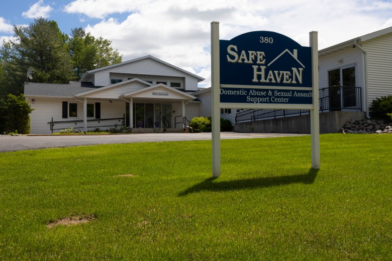 A sign for Safe Haven is posted on the front lawn on June 19, 2026. Executive Director Mindy Lohff teamed up with SAM25 leader Kendra Brusewitz and the Shawano Area United Way to educate the community about housing issues and to brainstorm solutions. (Joe Timmerman / Wisconsin Watch)