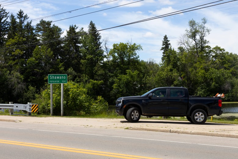 A truck pulls out of a Wolf River access point in Shawano, Wis., on June 19, 2026. Since Newcap closed, Shawano County residents no longer have a year-round homeless shelter. (Joe Timmerman / Wisconsin Watch)