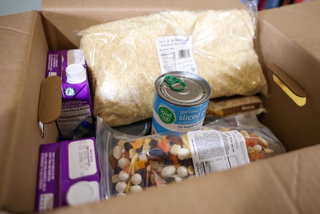 A box of Halal groceries from Feeding America Eastern Wisconsin sits on a table waiting to be distributed at Hanan Refugee Relief Group on Dec. 1, 2025, in Milwaukee. (Jonathan Aguilar / Milwaukee Neighborhood News Service / CatchLight Local)