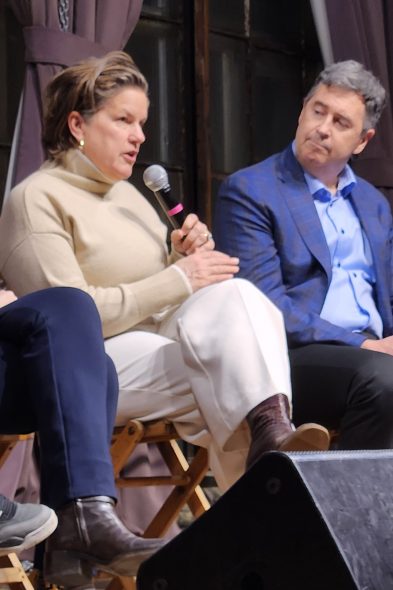 Joel Brennan listens as Missy Hughes speaks during a forum for Democrats running for governor on Wednesday evening, Jan. 21, 2026. Hughes suspended her campaign in June. (Photo by Erik Gunn/Wisconsin Examiner)