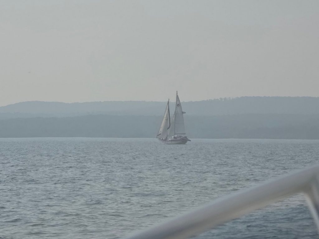 A hazy view of the shoreline around the Apostle Islands from Sean and Savanna Campbell’s Northern Lights Adventures Boat Charters and Tours in Bayfield. Photo courtesy of Savanna Campbell