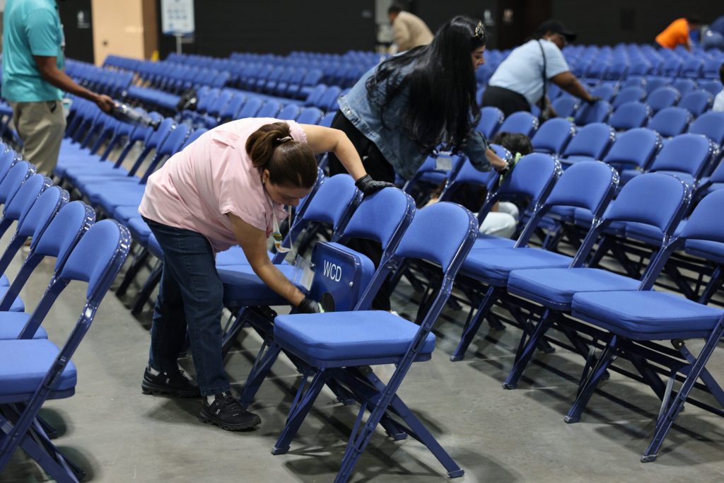 Volunteers clean thousands of chairs at the Baird Center in preparation for the Jehovah’s Witness convention on Aug. 28-30. Organizers say they see the Baird Center as a place of worship during the event and want to leave it better than they found it. Elissa Eaton/WPR