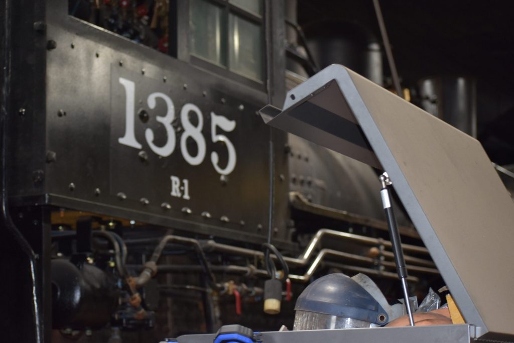 Engine 1385 was born in 1907, and hauled trains across Wisconsin. Now, volunteers are getting her ready to run once again. Avery Martinez/WPR