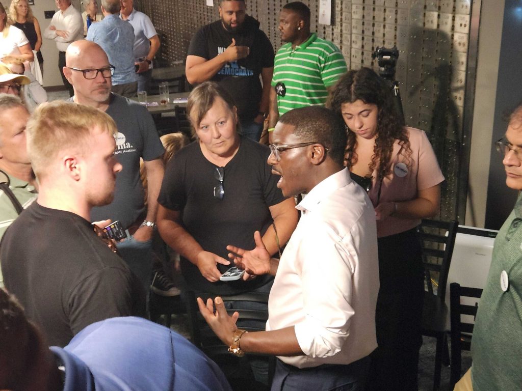 Milwaukee County Executive David Crowley, right, speaks with voters in the Fox Valley on Monday, Aug. 3, 2026. Joe Schulz/WPR