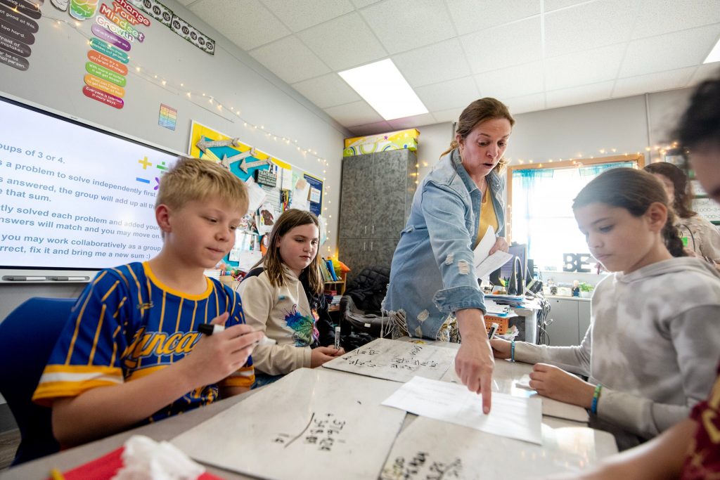 Fifth grade math teacher Missy Sperle helps her students during class Tuesday, April 29, 2025, at Winskill Elementary School in Lancaster, Wis. Angela Major/WPR