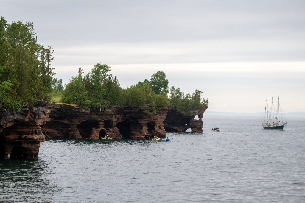 Kayakers explore the Apostle Islands on Wednesday, July 8, 2026, in Bayfield, Wis. Angela Major/WPR