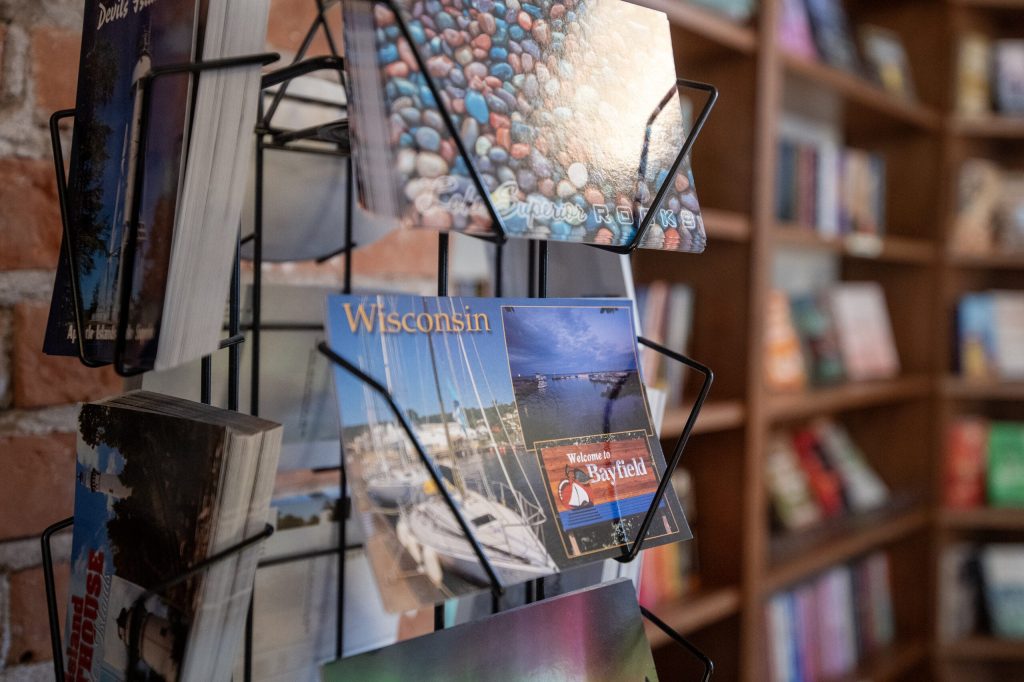 A postcard is sold in a Bayfield, Wis., store Wednesday, July 8, 2026. Angela Major/WPR