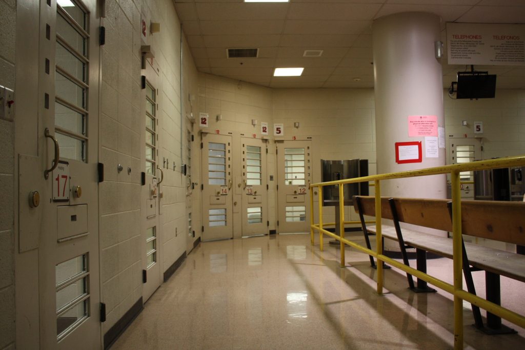 Rooms line the booking area at the Milwaukee County Jail. (NNS file photo)